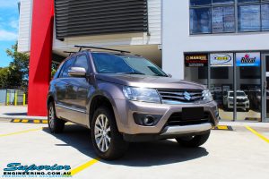 Right front side view of a Suzuki Grand Vitara in Gold after fitment of a Ironman 4x4 45mm Suspension Lift Kit