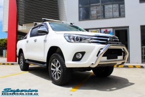 Right front side view of a White Toyota Revo Hilux Dual Cab after fitment of a Bilstein 2" Inch Lift Kit