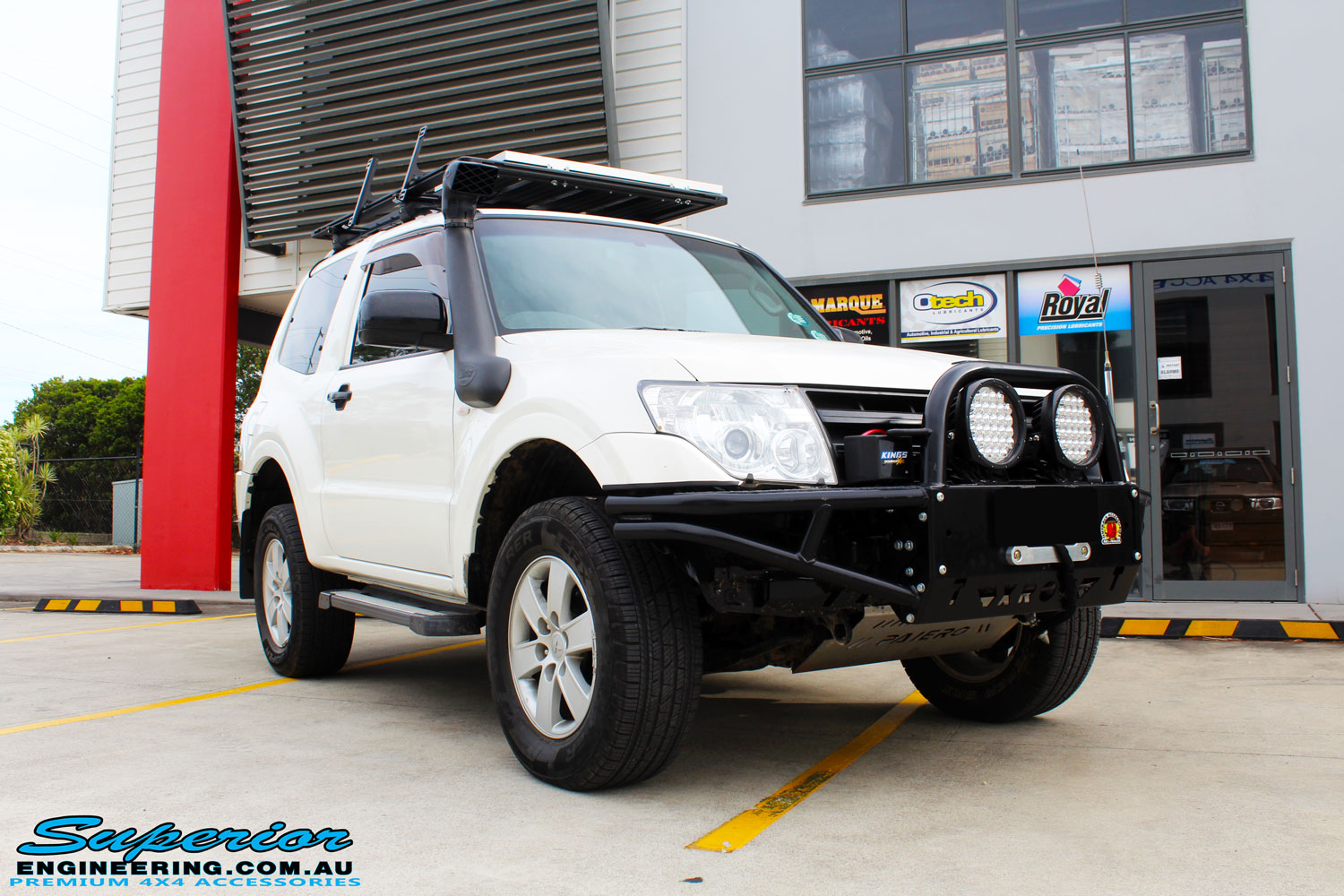 Right front side view of a White Mitsubishi Pajero SWB Wagon after fitment of a range of Superior and various other brands suspension components
