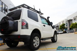 Rear right side view of a White Mitsubishi Pajero SWB Wagon after fitment of a range of Superior and various other brands suspension components