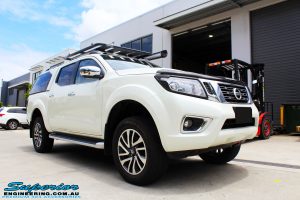 Right front side view of a White Nissan NP300 Navara Wagon before fitment of a range of Superior suspension components