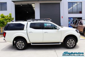 Right side view of a White Nissan NP300 Navara Wagon before fitment of a range of Superior suspension components