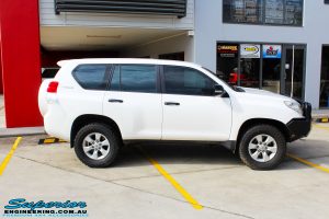 Right side view of a White Toyota 150 Landcruiser Prado Wagon before fitment of a Superior Remote Reservoir 2" Inch Lift Kit with King Coil Springs and a Ironman 4x4 Snorkel