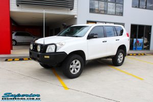 Right front side view of a White Toyota 150 Landcruiser Prado Wagon after fitment of a Superior Remote Reservoir 2" Inch Lift Kit with King Coil Springs and a Ironman 4x4 Snorkel