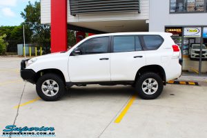 Right side view of a White Toyota 150 Landcruiser Prado Wagon after fitment of a Superior Remote Reservoir 2" Inch Lift Kit with King Coil Springs and a Ironman 4x4 Snorkel