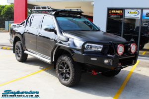 Right front side view of a Black Toyota Revo Hilux Dual Cab after fitment of a set of Superior Upper Control Arms & a Wheels & Tyre Package