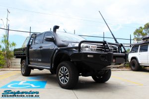 Left front side view of a Grey Toyota Revo Hilux Dual Cab after fitment of Superior Upper Control Arms, Extended Shackles & a Diff Drop Kit