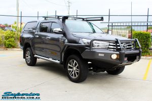 Left front side view of a Toyota Revo Hilux Dual Cab in Grey after fitment of a Superior Remote Reservoir 3" Inch Lift Kit