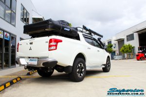 Rear left side view of a Mitsubishi MQ Triton Dual Cab before fitment of Superior Nitro Gas Front Struts and Rear Shocks with Front Coil Springs