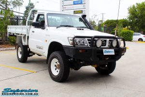 Front right side shot of this Nissan GU Patrol Ute after fitment of a Superior 4-5 Inch Lift Kit with Superior Remote Reservoir Shocks & Superior Hybrid 5 Link Radius Arms