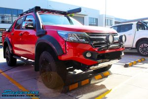Front right corner view of a Holden RG Colorado Dual Cab in Red after fitment of a Colour Coded Rhino 4x4 Evolution 3D Winch Bar with Warn Winch
