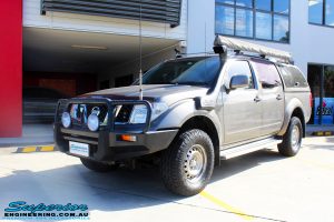 Left front side view of a Nissan D40 Navara Dual Cab after fitment of a Superior Nitro Gas 2" Inch Lift Kit with King Springs & a Safari Snorkel
