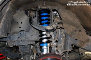 Front left inside guard view of the fitted Superior Nitro Gas 2" Strut with Coil Spring