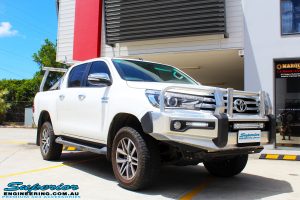Right front side view of a Toyota Revo Hilux Dual Cab in White after fitment of a Superior Nitro Gas 2" Inch Lift Kit