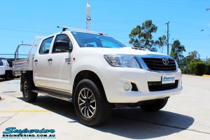 Right front side view of a Toyota Vigo Hilux Dual Cab before fitment of a Superior Remote Reservoir 2" Inch Lift Kit with King Coil Springs