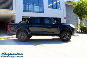 Left side view of a Black Holden RG Colorado Dual Cab after fitment of a Superior Nitro Gas 2" Inch Lift Kit with King Coil Springs, Fuel Beast Wheels & Toyo Open Country Tyres