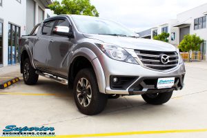 Left front side view of a Mazda BT50 Dual Cab in Silver after fitment of a Superior Nitro Gas 2" Inch Lift Kit with King Coil Springs