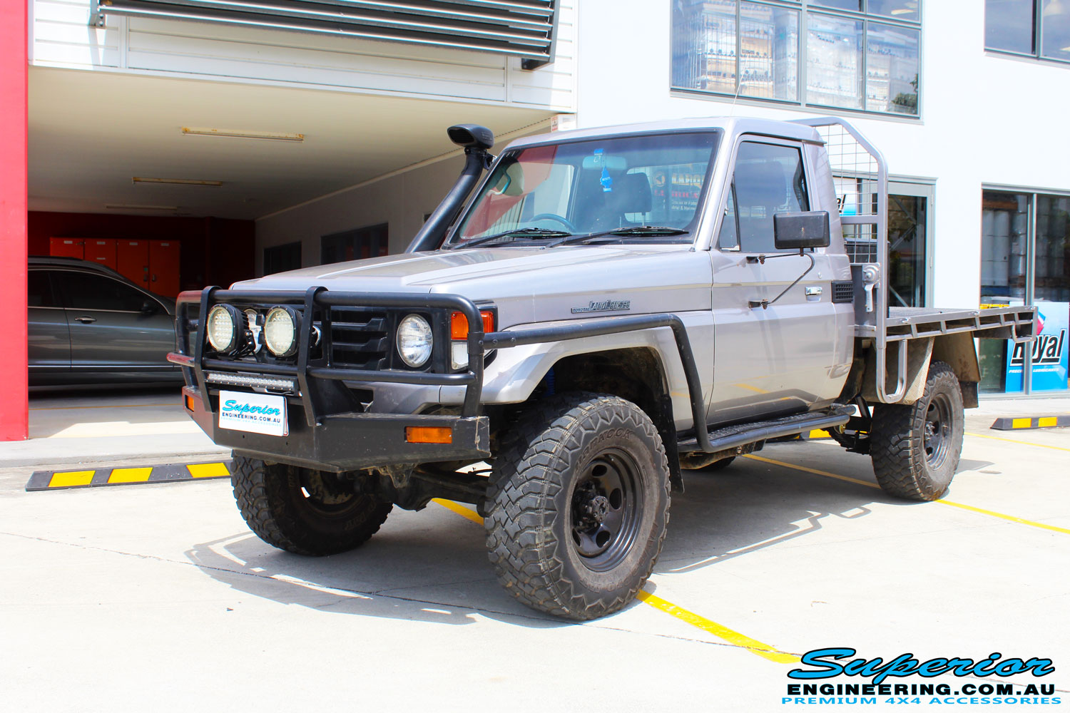 Left front side view of a Silver Toyota 79 Series Landcruiser after fitment of a Superior Nitro Gas 2" Inch Lift Kit