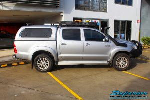 Left side view of a Toyota Vigo Hilux Dual Cab before fitment of a Superior Remote Reservoir 2" Inch Lift Kit with King Coil Springs