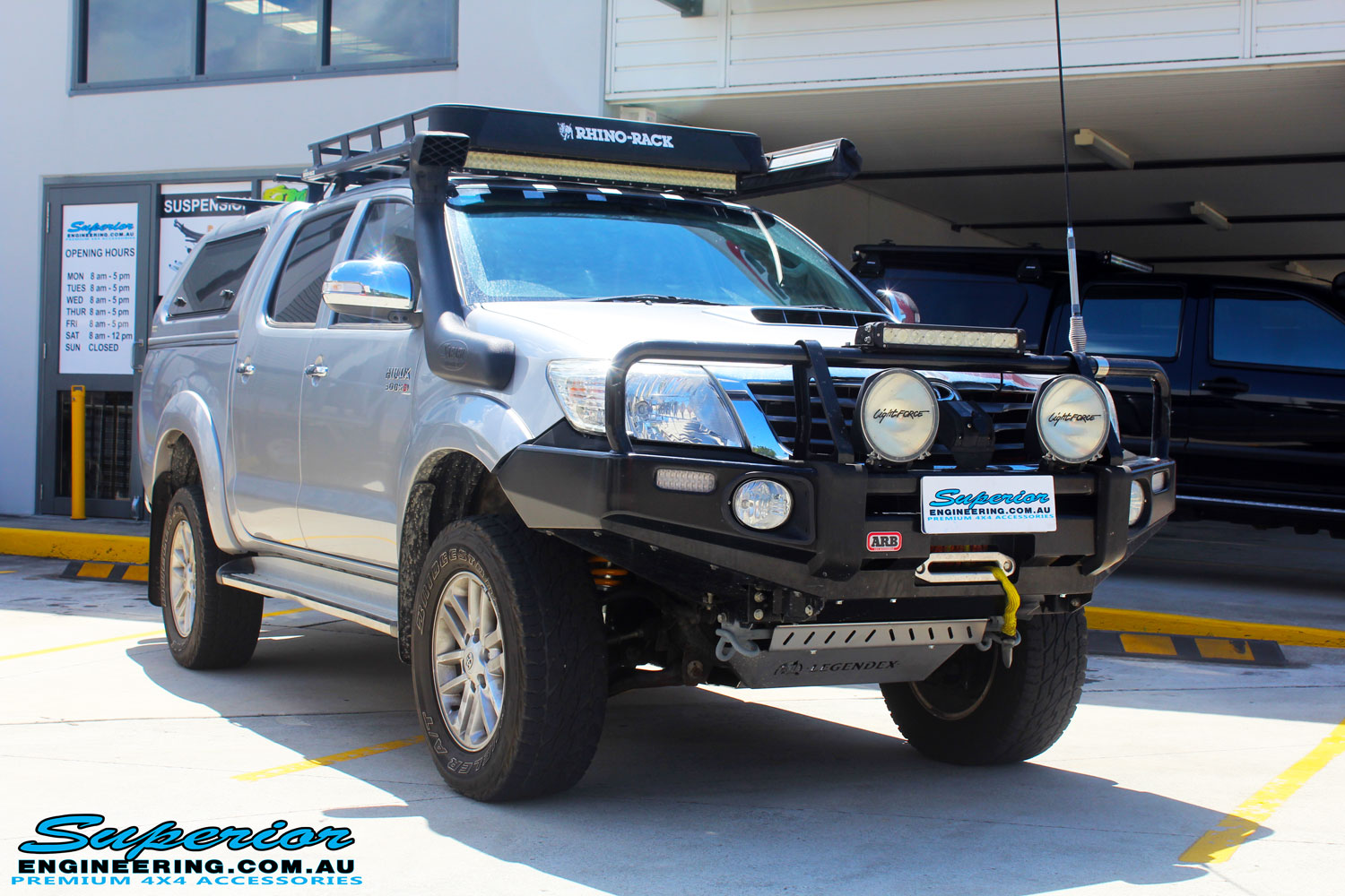 Right front side view of a Toyota Vigo Hilux Dual Cab after fitment of a Superior Remote Reservoir 2" Inch Lift Kit with King Coil Springs