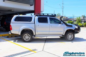 Right side view of a Toyota Vigo Hilux Dual Cab after fitment of a Superior Remote Reservoir 2" Inch Lift Kit with King Coil Springs