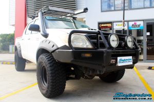 Right front side view of a Toyota Vigo Hilux Dual Cab before fitment of a Superior Remote Reservoir 3" Inch Lift Kit with King Coil Springs