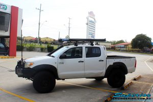 Left side view of a Toyota Vigo Hilux Dual Cab before fitment of a Superior Remote Reservoir 3" Inch Lift Kit with King Coil Springs