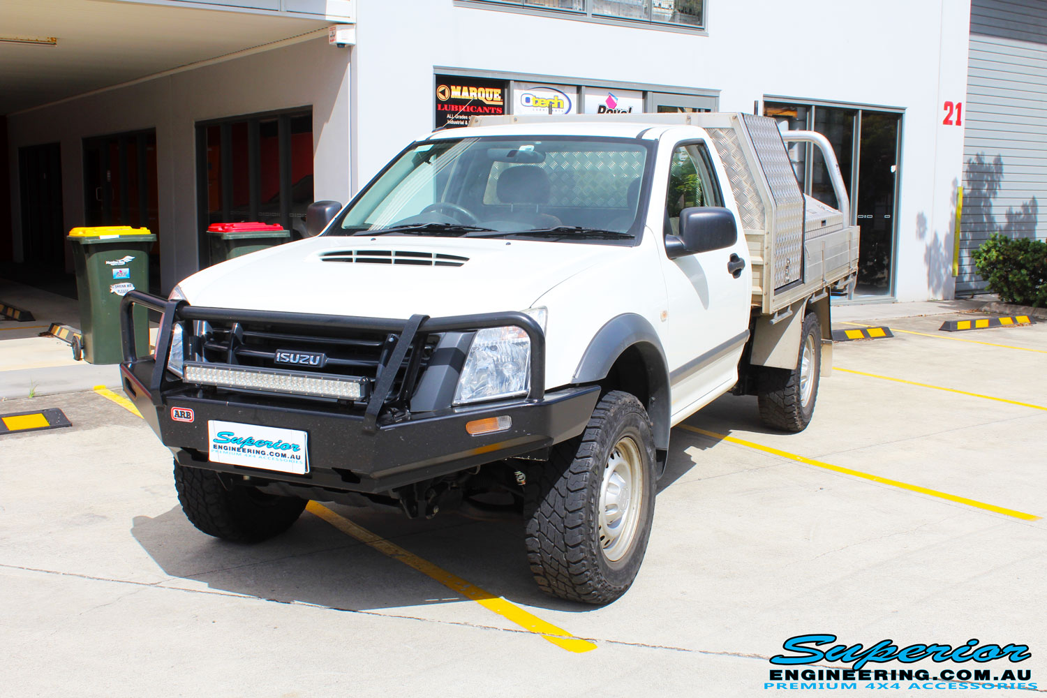 Left front side view of a White Isuzu D-Max Single Cab after fitment of a EFS 40mm Lift Kit