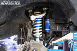 Front right inside guard view of the fitted Remote Reservoir Front Strut + Coil Spring & Superior Upper Control Arm
