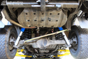 Rear mid underbody shot of the fitted Superior Nitro Gas 2" Shocks + Coil Springs & Superior Rear Adjustable Panhard Rod