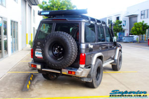 Rear right side view of a Toyota 76 Series Landcruiser Wagon in Grey before fitment of a EFS 2" Lift Kit