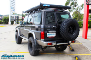 Rear left side view of a Toyota 76 Series Landcruiser Wagon in Grey before fitment of a EFS 2" Lift Kit