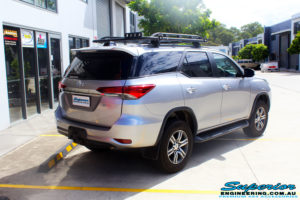 Rear right side view of a Toyota Fortuner Wagon in Silver before fitment of a Fox 2.0 Performance Series IFP 2" Inch Lift Kit with Airbag Man Coil Helper Air Kit