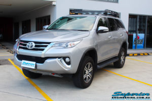Left front side view of a Toyota Fortuner Wagon in Silver after fitment of a Fox 2.0 Performance Series IFP 2" Inch Lift Kit with Airbag Man Coil Helper Air Kit