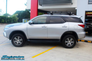 Left side view of a Toyota Fortuner Wagon in Silver after fitment of a Fox 2.0 Performance Series IFP 2" Inch Lift Kit with Airbag Man Coil Helper Air Kit