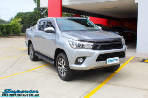 Right front side view of a Toyota Revo Hilux Dual Cab in Silver before fitment of a 3" Inch Lift Kit with King Coil Springs, Superior Billet Alloy Upper Control Arms and Body Lift Kit
