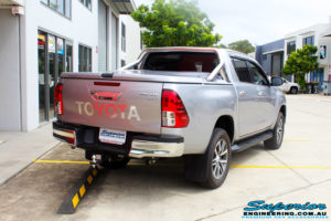 Rear right view of a Toyota Revo Hilux Dual Cab in Silver before fitment of a 3" Inch Lift Kit with King Coil Springs, Superior Billet Alloy Upper Control Arms and Body Lift Kit