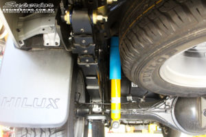 Rear left underbody view of the fitted Bilstein Shock Absorber, EFS Leaf Spring & Superior Body Lift Kit