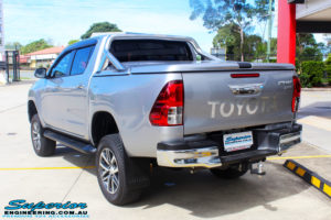 Rear left view of a Toyota Revo Hilux Dual Cab in Silver after fitment of a 3" Inch Lift Kit with King Coil Springs, Superior Billet Alloy Upper Control Arms and Body Lift Kit