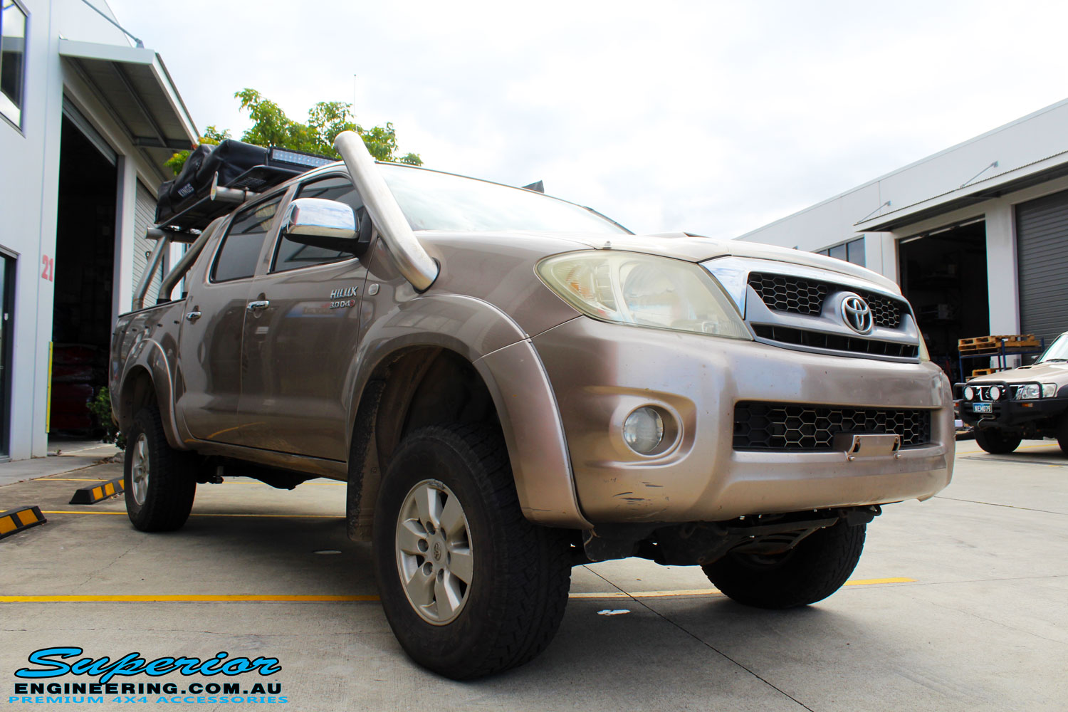 Right front side view of a Toyota Vigo Hilux Dual Cab after fitment of a Superior Nitro Gas 3" Inch Lift Kit